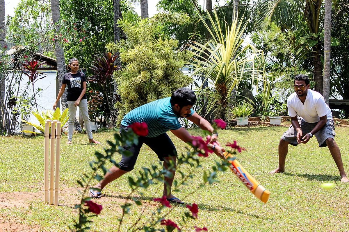 Konekt colleagues playing cricket during the 2017 company trip and Avurudu celebration
